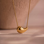 Load image into Gallery viewer, Curved Bean Pendant Necklace